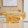 303d9b7e22ef33d215c3dd3c66c11f44.webp Ceramic Golden Arowana Feng Shui Ornament
